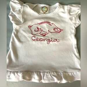 Razorback hog & Georgia (name) red embroidered on white ruffle shirt. 18 mo.